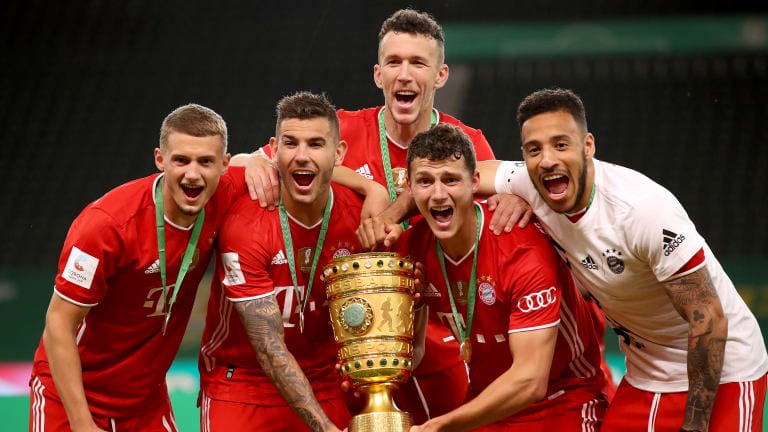 (L-R) Michael Cuisance, Lucas Hernandez, Ivan Perisic, Benjamin Pavard and Corentin Tolisso of FC Bayern Muenchen pose with the trophy