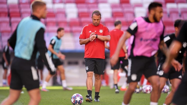 Hans-Dieter Flick, Head Coach of FC Bayern Munich checks his watch