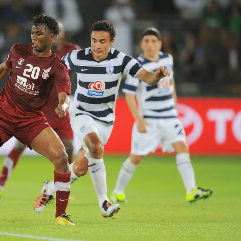 Modibi Diarra of Al-Wahda Sports Club battles Leobardo Lopez of Club de Futbol Pachuca