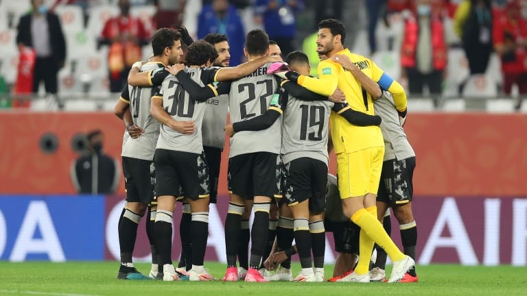 The Al Ahly SC team form a huddle on the pitch prior to the FIFA Club World Cup