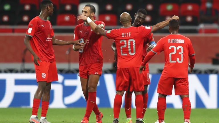 Almoez Ali of Al Duhail SC celebrates with teammate Ali Afif