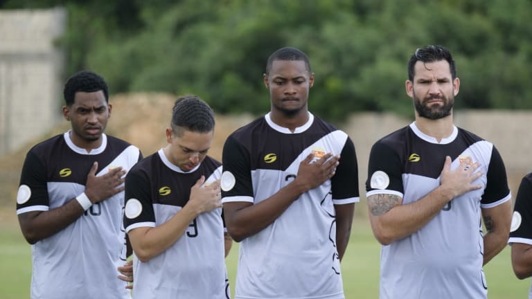 Cayman Islands line up for the national anthem