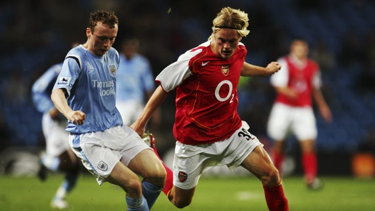 Willo Flood of Manchester City evades Sebastian Larsson of Arsenal