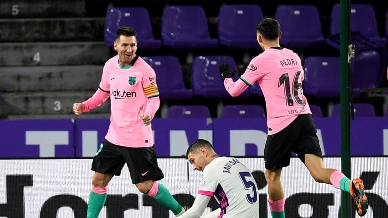 Lionel Messi of Barcelona celebrates with Pedri