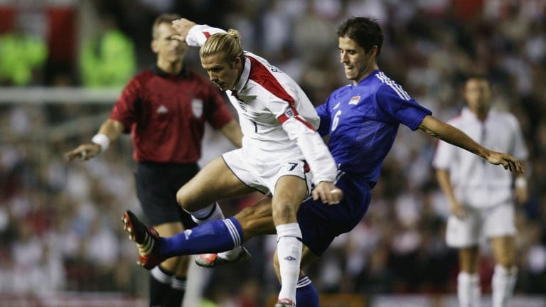David Beckham of England clashes with Martin Stocklasa of Liechtenstein
