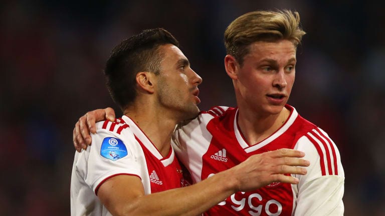 Dusan Tadic of Ajax celebrates after he takes and scores his second penalty