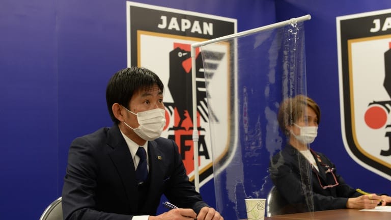 Japan Olympic football team head coach Hajime Moriyasu and Japan women's national football team head coach Asako Takakura watch the Tokyo 2020 Olympic Football Tournament draws