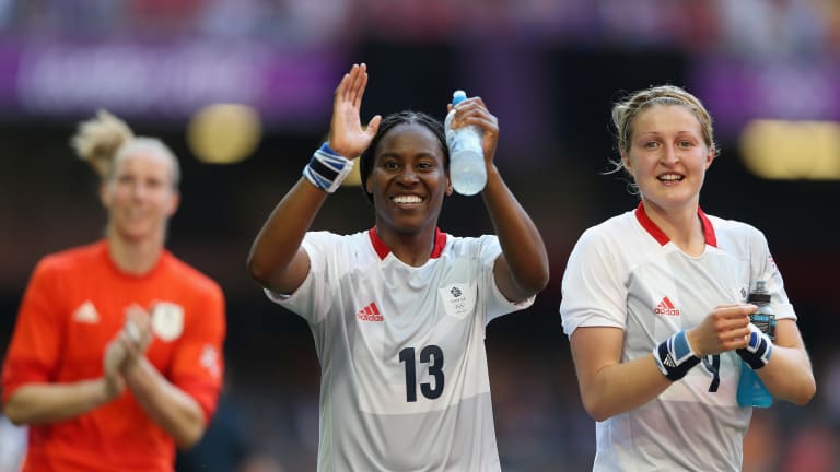 Ifeoma Dieke of Great Britain and Ellen White of Great Britain thank the support after the Women's Football first round Group E Match of the London 2012 Olympic Games between Great Britain and New Zealand at Millennium Stadium on July 25, 2012 in Cardiff, Wales.