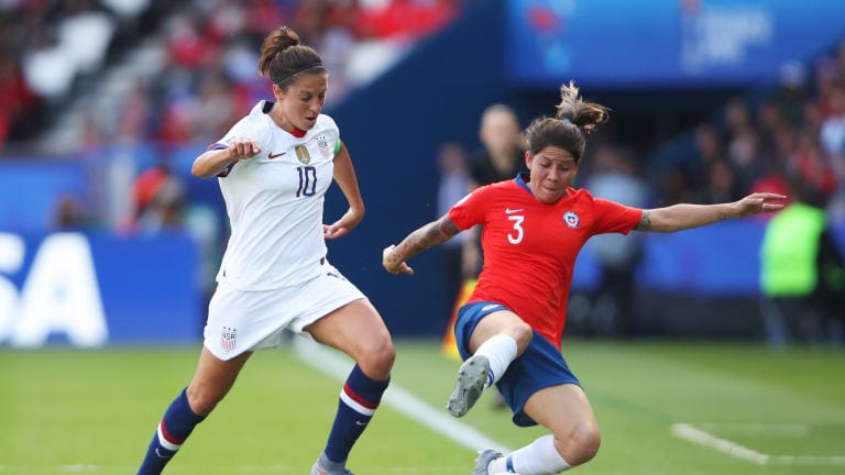 Carla Guerrero of Chile evades Carli Lloyd of the United States during the 2019 FIFA Women's World Cup