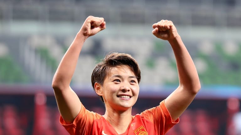 Wang Shuang celebrates after qualifying for the Olympics