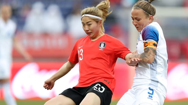 Korea Republic forward Kang Chaerim (L) competes for the ball