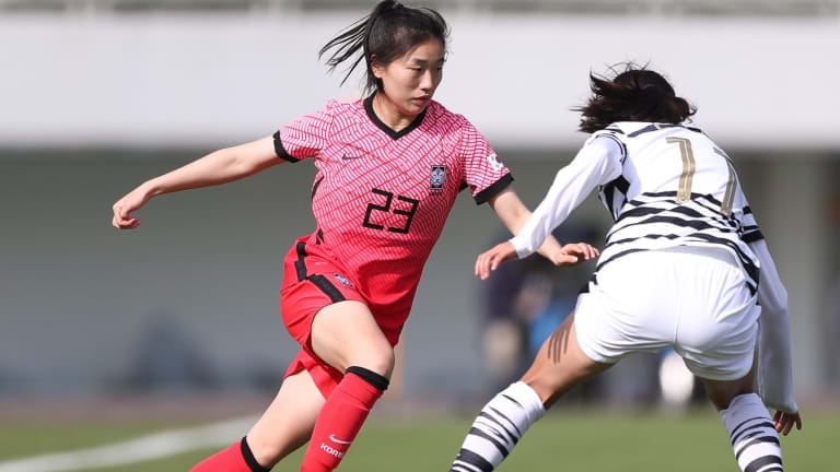 Korea Republic forward Kang Chaerim (L) competes for the ball
