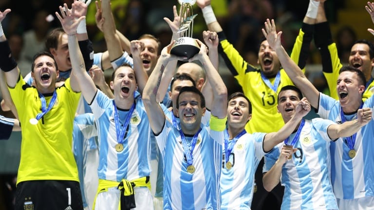 Fernando Wilhelm of Argentina holds the trophy during the FIFA Futsal World Cup Final match between Russia and Argentina