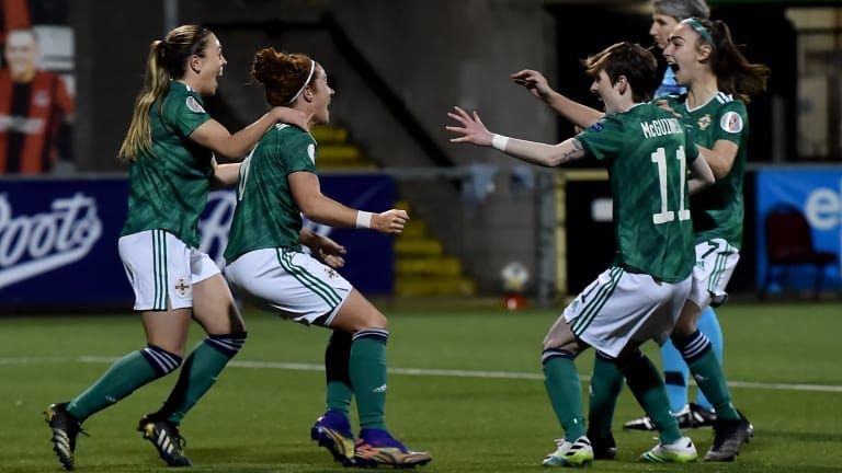 Marissa Callaghan of Northern Ireland celebrates with teammates after scoring their team's first goal during the UEFA Women's Euro 2022 Play-off match between Northern Ireland and Ukraine at Seaview on April 13, 2021 in Belfast, Northern Ireland.