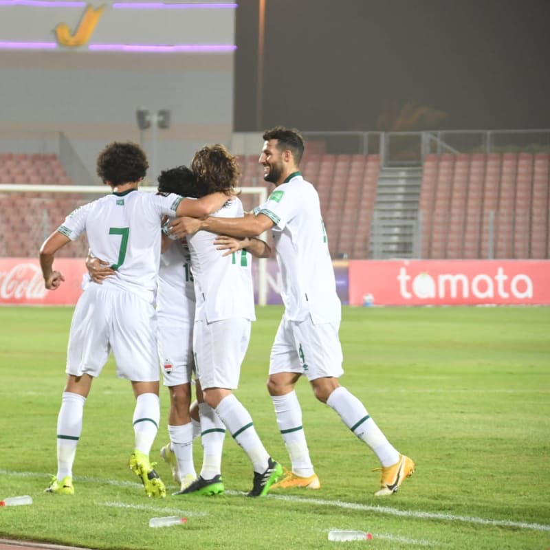 Iraq players celebrate after scoring against Hong Kong