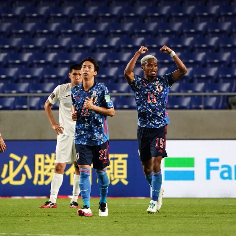 Ado Onaiwu (2nd R) of Japan celebrates scoring his side's first goal with his team mates 