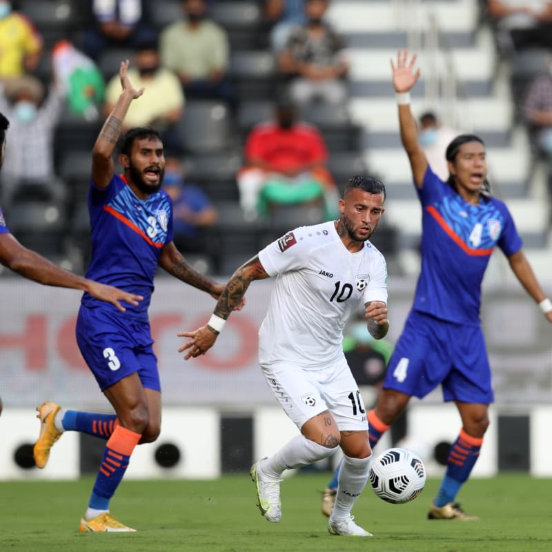 Faysal Shayesteh of Afghanistan dribbles against India 