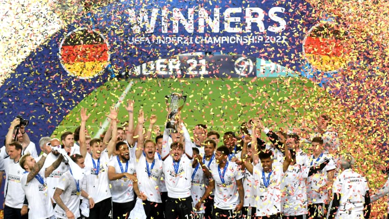 Mergim Berisha of Germany lifts the UEFA European Under-21 Championship trophy
