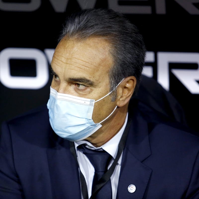 Martín Lasarte head coach of Chile wearing a face mask looks on during a match between Chile and Bolivia
