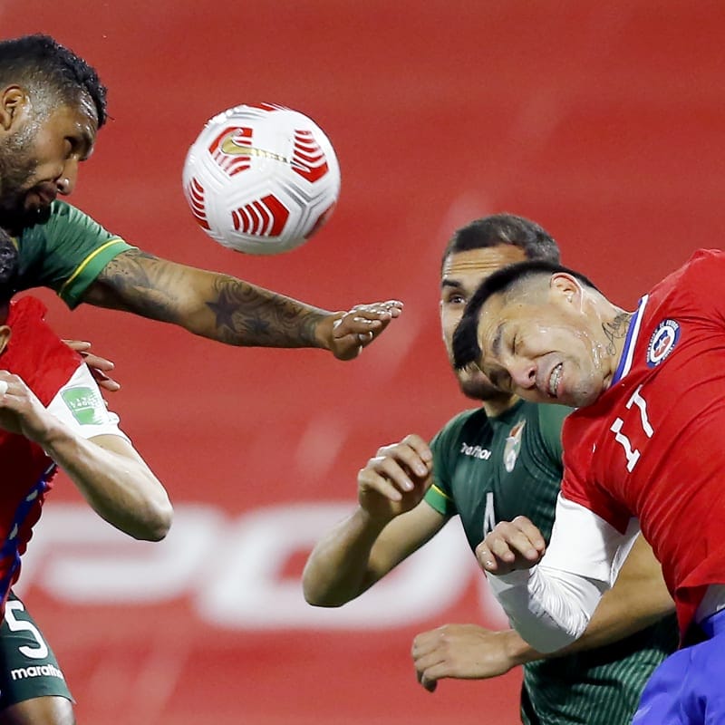 Adrián Jusino of Bolivia jumps for the ball with Guillermo Maripán (R) and Gary Medel of Chile&nbsp;
