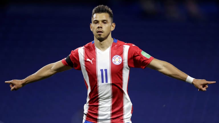 Angel Romero celebrates giving Paraguay the lead from the spot
