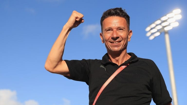 Head coach of Switzerland, Angelo Schirinzi celebrates his teams win 
