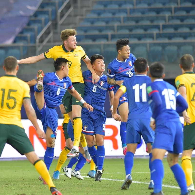 Harry Souttar of Australia heads in from a corner kick