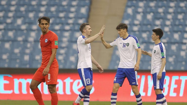Uzbekistan celebrate scoring against Singapore