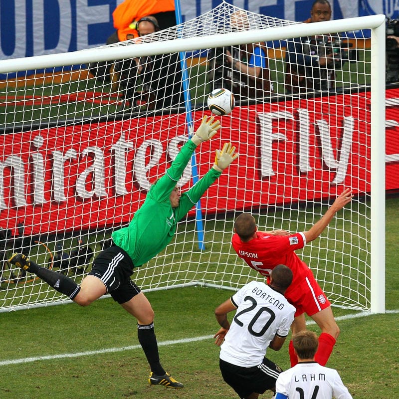 BLOEMFONTEIN, SOUTH AFRICA - JUNE 27: Matthew Upson of England heads the ball past Manuel Neuer of