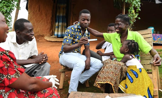 A family undergoes a HIV screening test at home in southwest Côte d’ivoire.  A family undergoes a HIV screening test at home in southwest Côte d’ivoire.