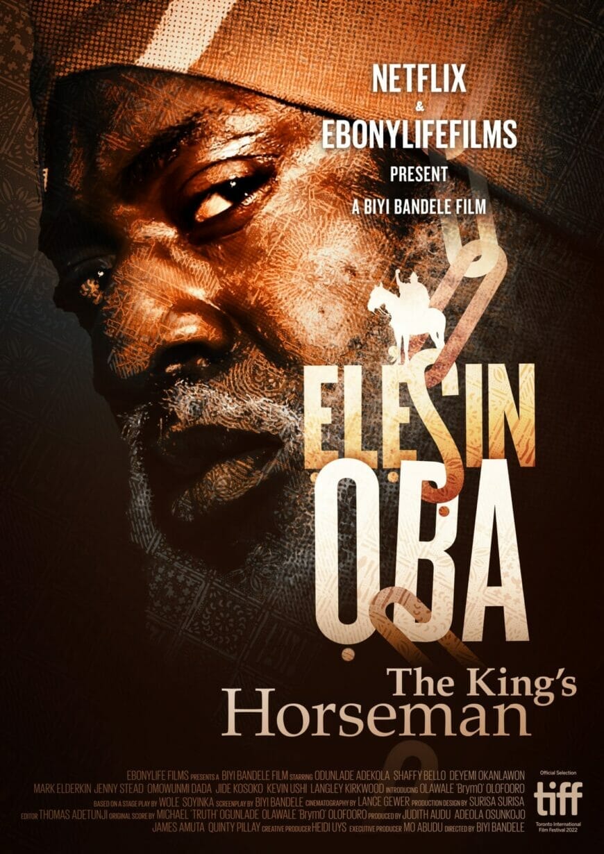 A movie poster featuring a man looking sideways and with suspicion. He has a greying beard and moustache.