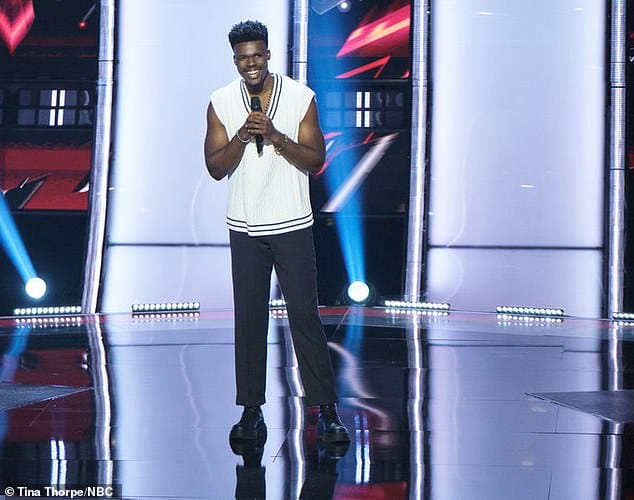Four chairs: Andrew ultimately chose Camila to be his coach and she stood up with both arms in the air