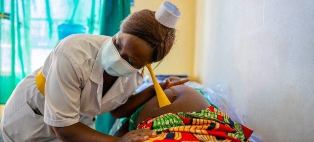 A nurse examines a pregnant mother during an antenatal care visit at a health centre in Uganda. A nurse examines a pregnant mother during an antenatal care visit at a health centre in Uganda.