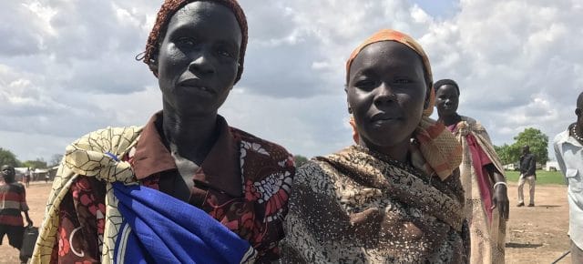 Women at a WFP food distribution site in Agok, in the Abyei Administrative Area in South Sudan. Women at a WFP food distribution site in Agok, in the Abyei Administrative Area in South Sudan.