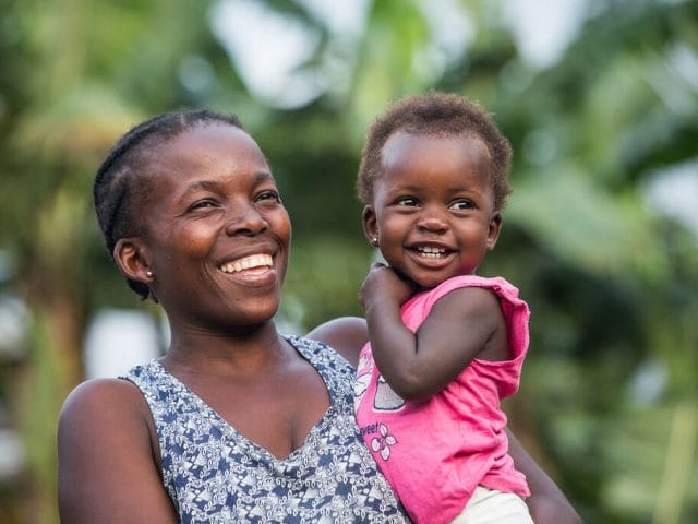 A mother holds her 18-month-old daughter in Sao Tomé e Principe. A mother holds her 18-month-old daughter in Sao Tomé e Principe.