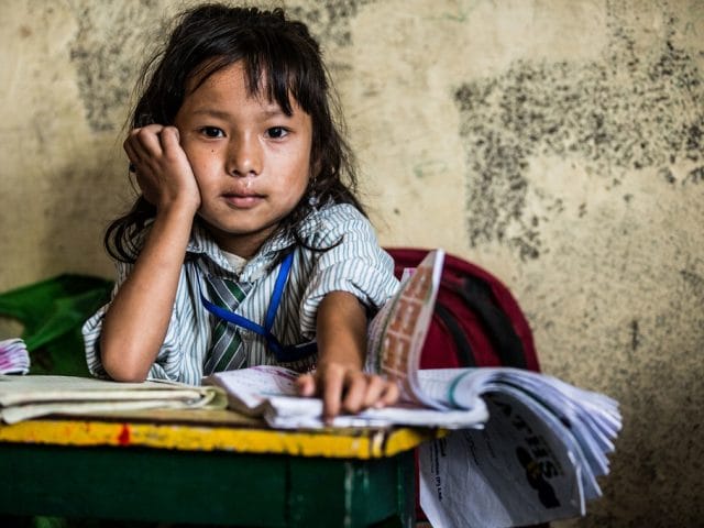 A young girl hard at study in Nepal. A young girl hard at study in Nepal.