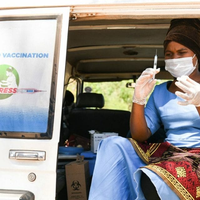 A health worker prepares to administer COVID-19 vaccines at a village in Kasungu, Malawi. A health worker prepares to administer COVID-19 vaccines at a village in Kasungu, Malawi.