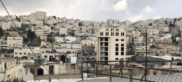 Palestinian houses and Israeli settlements in H2 area in Hebron, West Bank. Palestinian houses and Israeli settlements in H2 area in Hebron, West Bank.