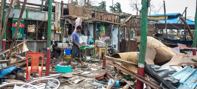 A local resident cleans up the extensive damage to his shop caused by Cyclone Mocha in Sittwe, Rakhine state, Myanmar. A local resident cleans up the extensive damage to his shop caused by Cyclone Mocha in Sittwe, Rakhine state, Myanmar.