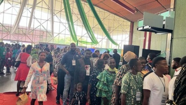Participants wait to enter the International Conference Center in Abuja, Nigeria