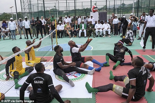 Members of the Nigeria Unconquered team can be seen here on the left, dressed in yellow, while players on the Chief of Defence staff squad are seen wearing black