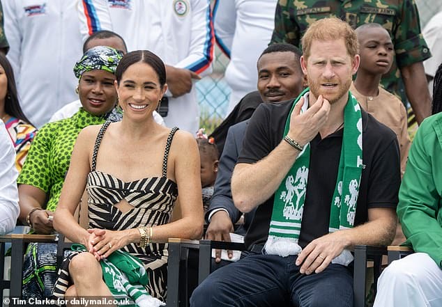 Prince Harry and his wife Meghan at a sitting volleyball exhibition match today in Abuja, Nigeria