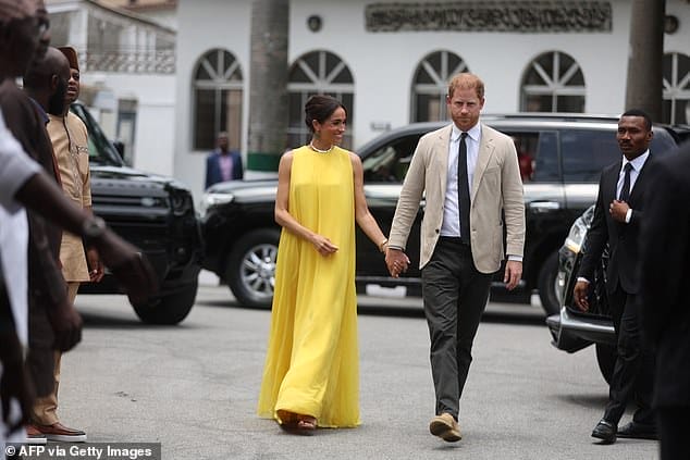 Meghan arrives at State Governor House in yellow dress she wore for Archie pregnancy announcement as she honours Nigerian roots