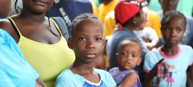 Families gather at a site for displaced persons in Tabarre, Haiti. Families gather at a site for displaced persons in Tabarre, Haiti.