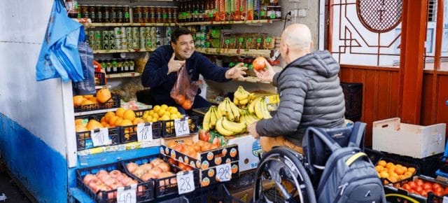 Despite all technical difficulties of leaving home, Dmitry Kuzuk does his own shopping and leads independent life in Moldova. (file)