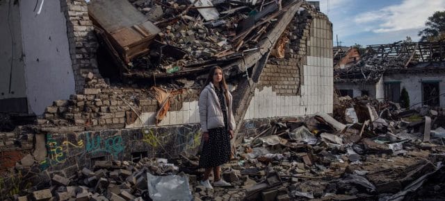A Ukrainian teenager stands in the rubble of her destroyed school in Zhytomyr (file). A Ukrainian teenager stands in the rubble of her destroyed school in Zhytomyr (file).